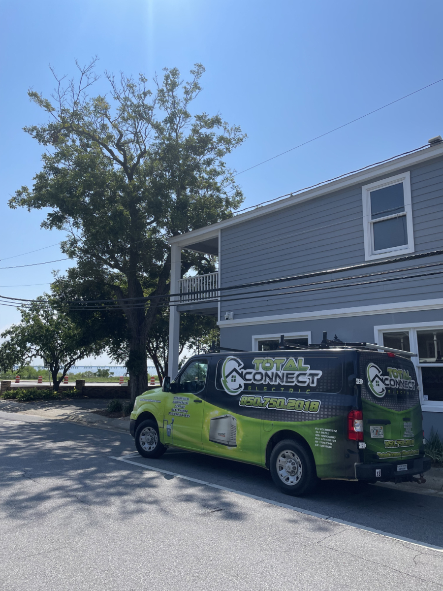 Total Connect Electric service vehicle on a Northwest Florida job site